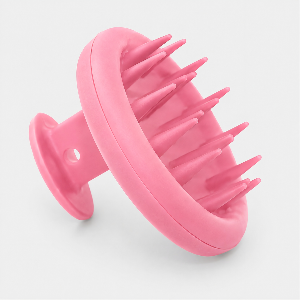Pinke UTTENS Kopfmassagebürste aus Silikon mit weichen Massagenoppen zur Kopfhautmassage und Haarwäsche.